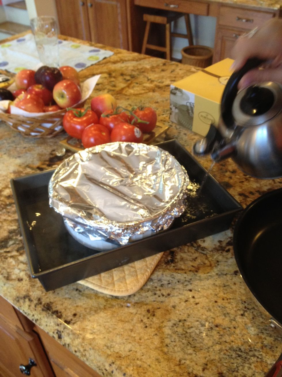 Add the boiling water ( about an inch or two of water) to the roast pan and put into the heated oven
