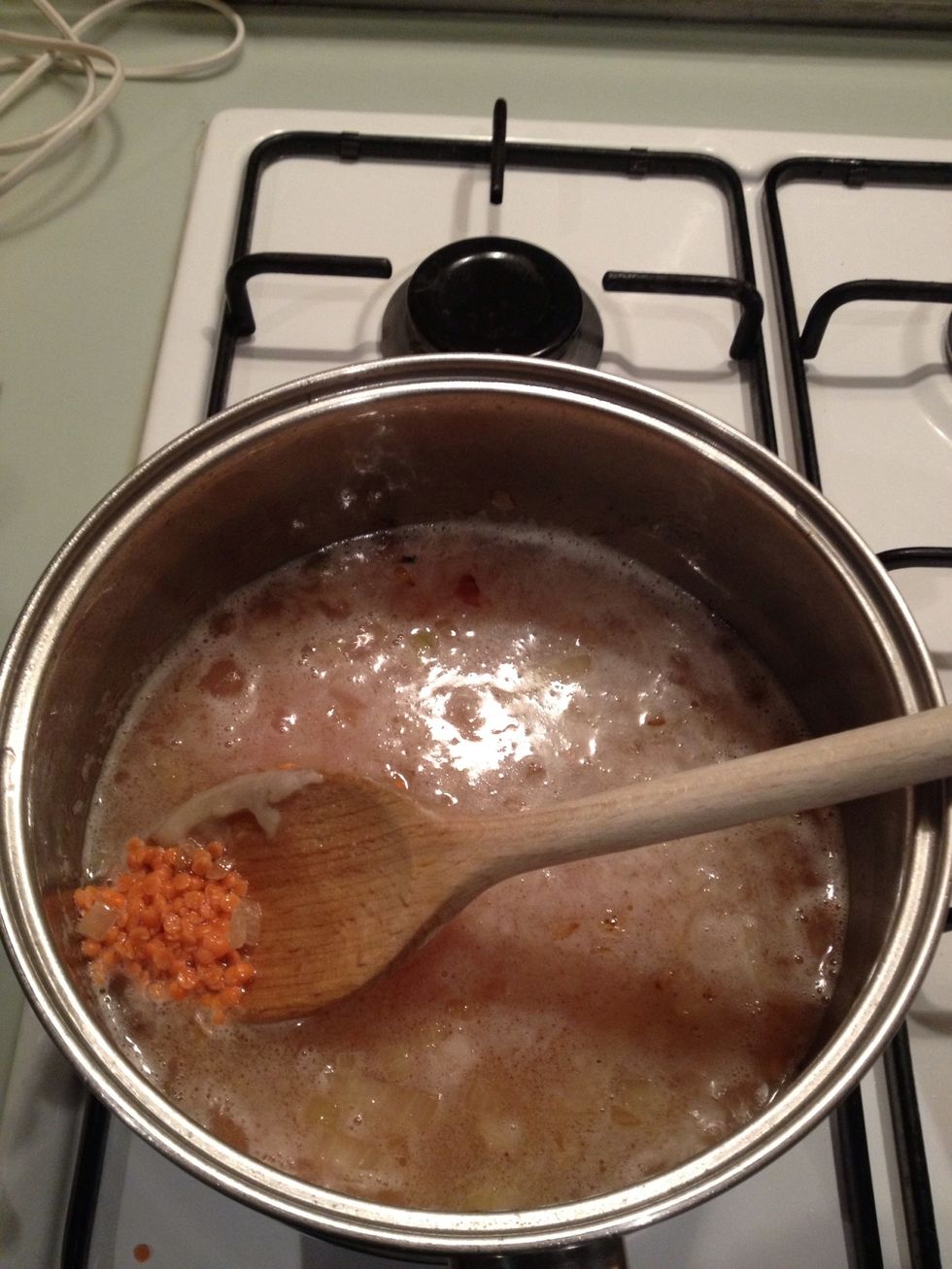 Add the boiling water and red lentils and bring to boil