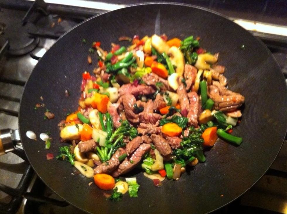 Add the bok Choy and broccolini constantly constantly stir for a minute or two Add the veal then add the oyster sauce and a splash of soy sauce constantly stif for a minute or 2