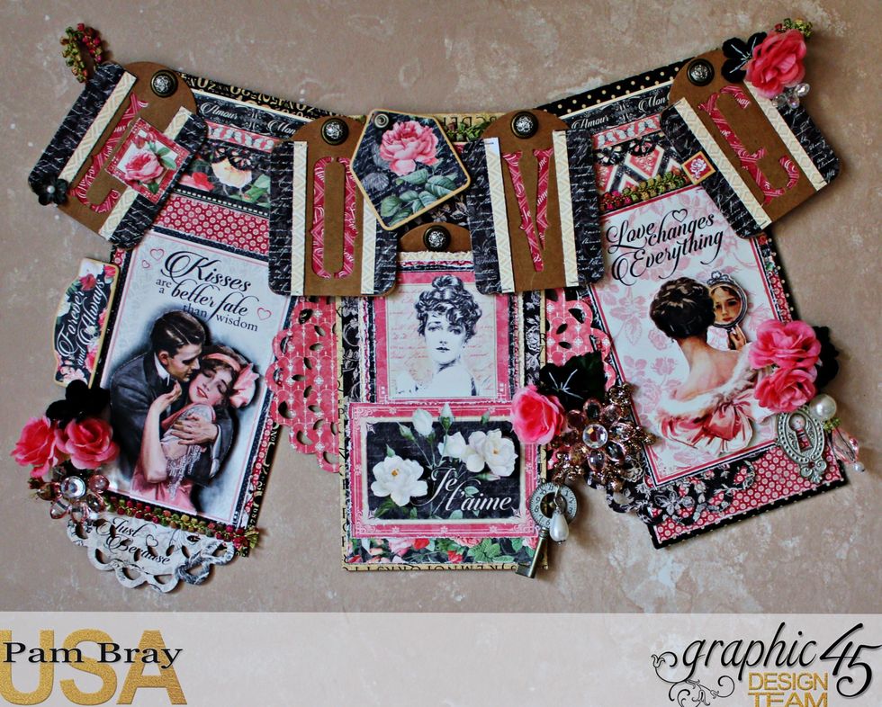 Add the brads to the top of tags and some Mon Amour Chipboard pieces to finish decorating your Mon Amour Banner.