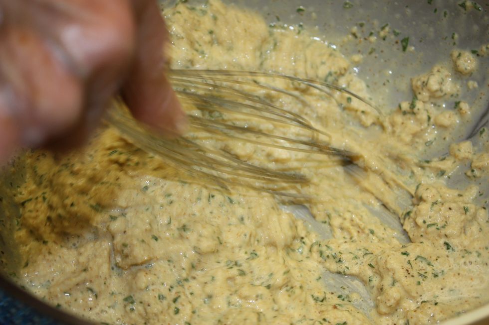 Add the bread to the egg/milk mixture and whisk it together.