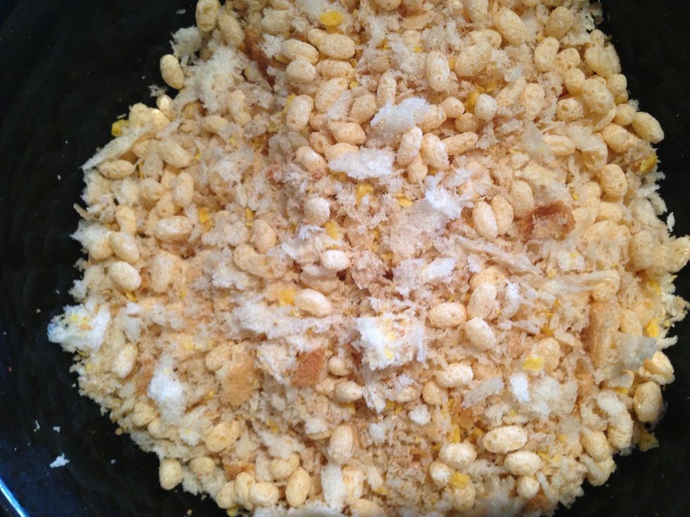 Add the breadcrumb mix into a bowl with the Rice Krispies