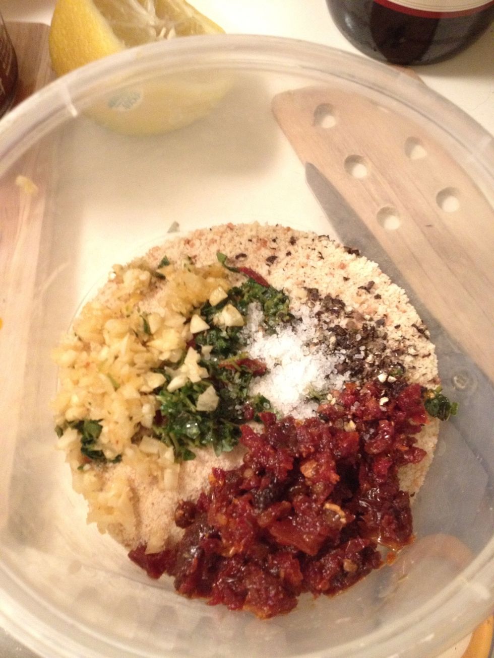 Add the breadcrumb, Tomatoe, garlic, herbs, salt & pepper into mixing bowl. You can squeeze half a lemon into the mix as well