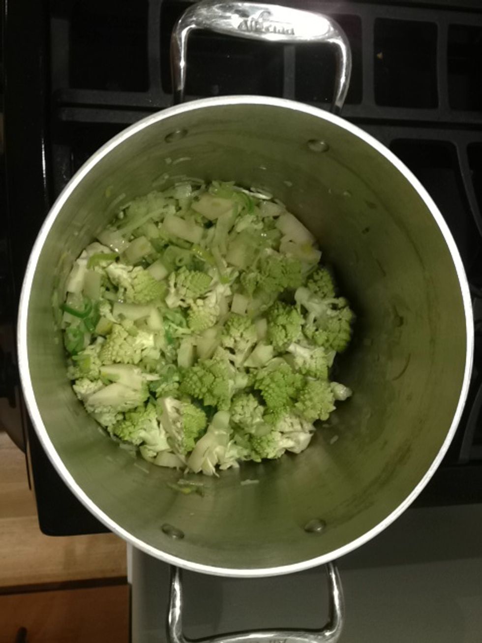 Add the broccoli florets and the potato and saut\u00e9 for about 5 minutes.