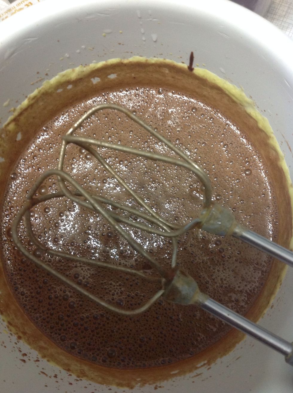 Add the brown liquid to eggs and mix