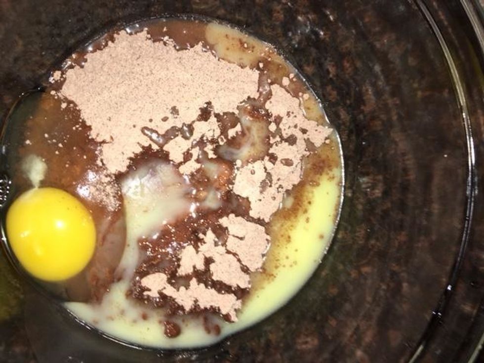 Add the Brownie mix, 2 Tablespoons of water, melted butter and an egg into a medium sized bowl.