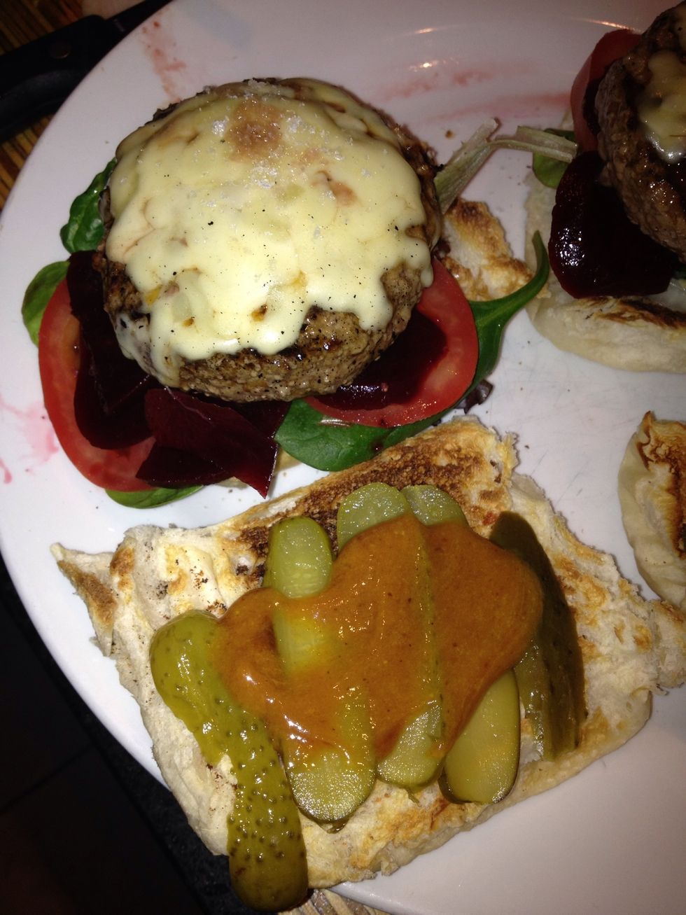 Add the burger patty and the gherkins and the sauce and you're good to go