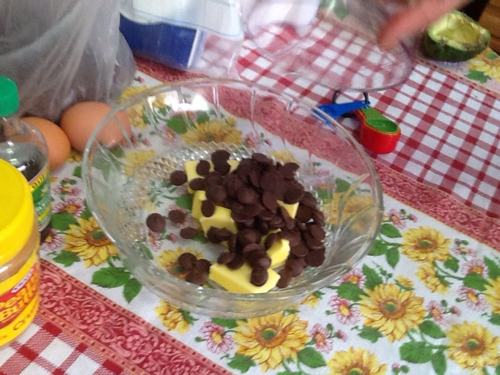 Add the butter and 3/4 cup of chocolate chips in a microwave-safe bowl and heat for 1 to 2 minutes until melted.
