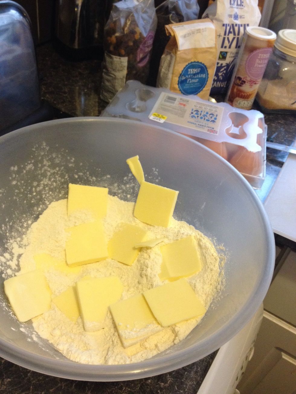 Add the butter and granulated sugar (slice the butter into thin manageable slices or attack it as one big lump...)