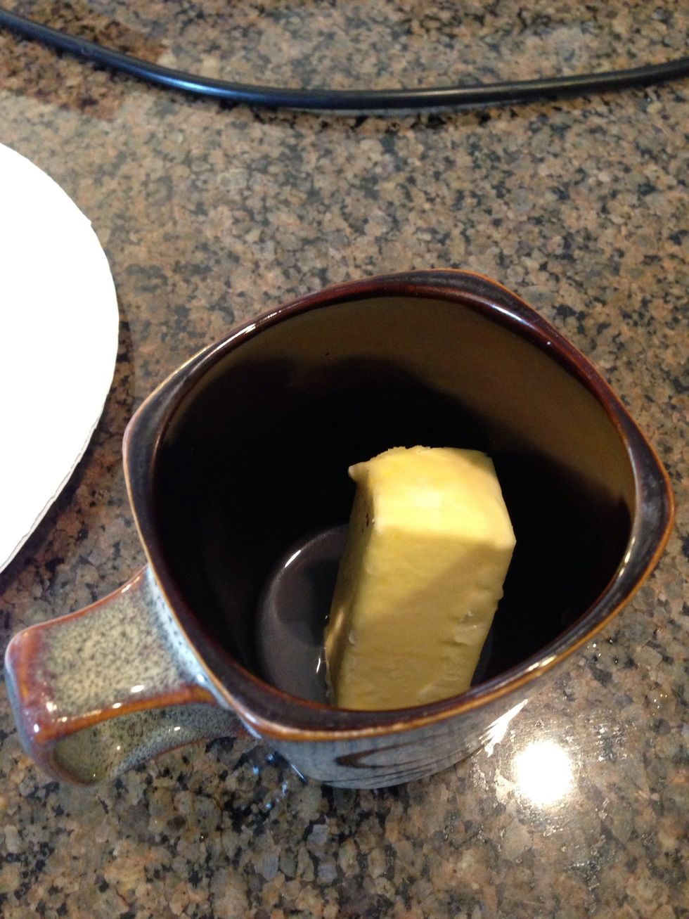 Add the butter and lemon juice in a coffee cup or other container and melt in the microwave.