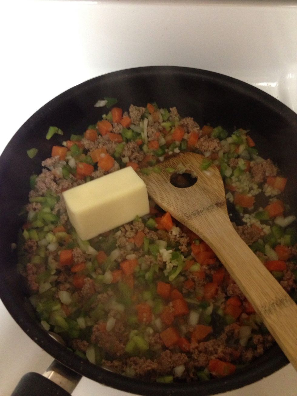 Add the butter and some soy sauce, and cook for about 5 minutes