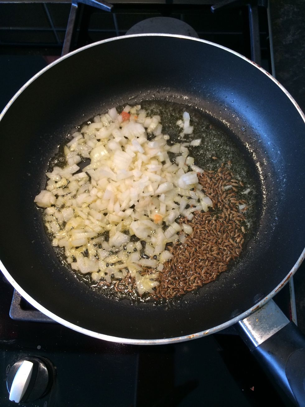 Add the butter and tsp of cumin to a medium flame pan. Saut\u00e9 the onions till translucent