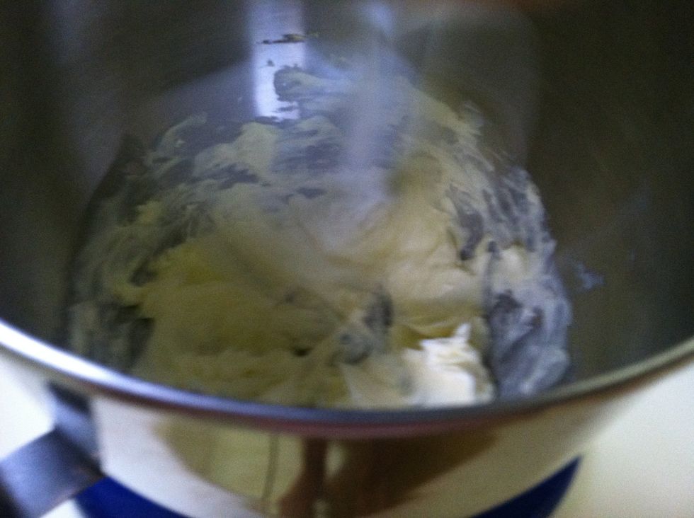 Add the butter into the blender to soften and lighten the butter. This step is essential because it adds air to the banana bread. Don't make the mixer too high or the butter will go everywhere.