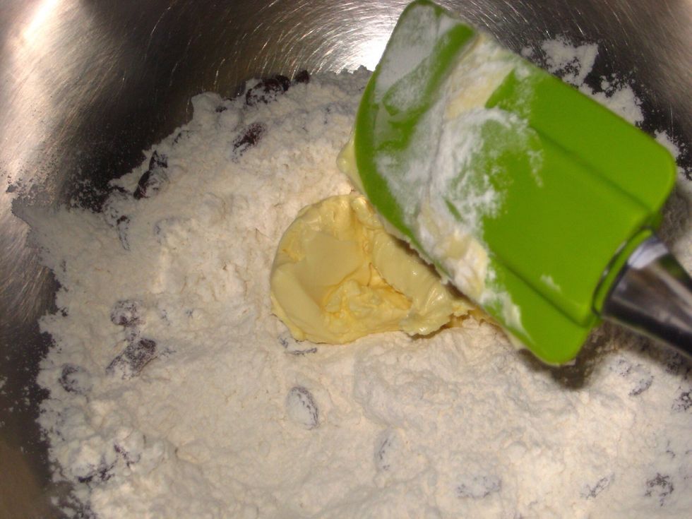 Add the butter/margarine to the flour. The butter should be slightly hard to be mixed into the flour. You can cube it for ease in mixing it.