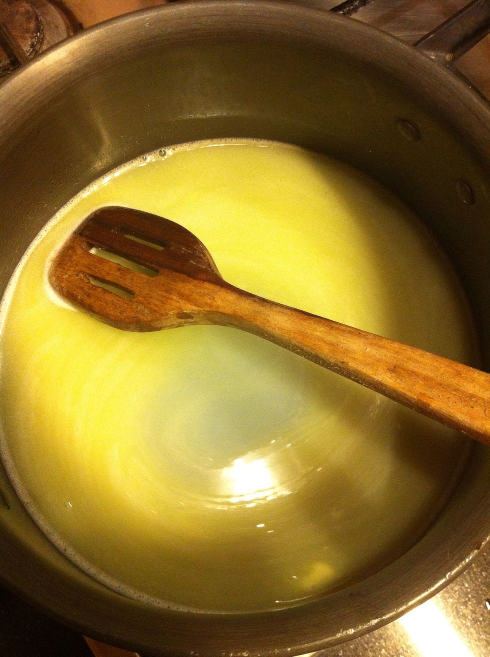 Add the butter to the water in a saucepan and bring to a boil.