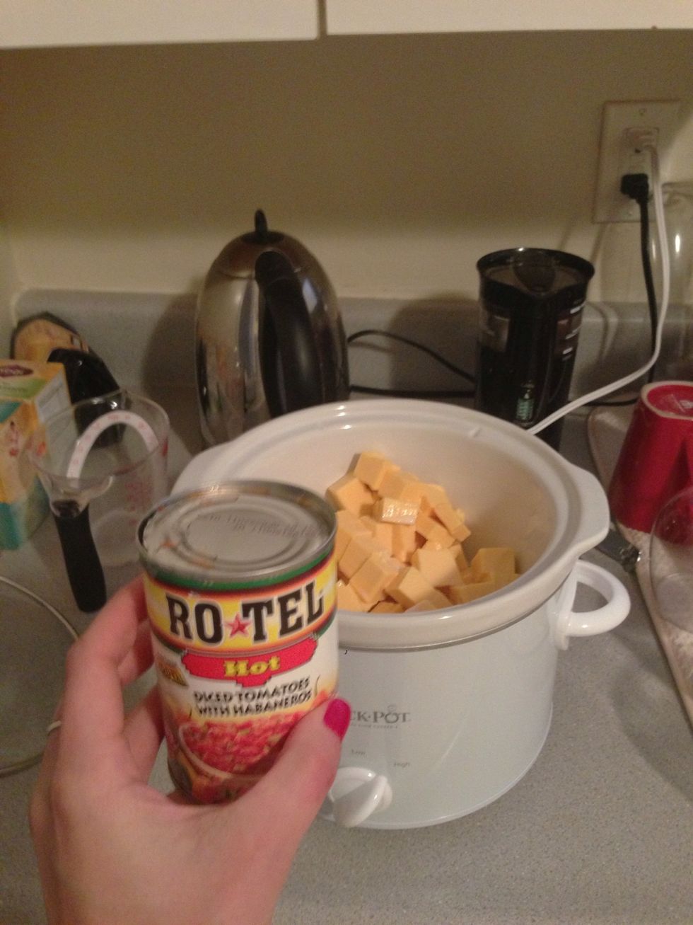 Add the can of rotel. I use the hot kind. I you want even more of a kick, add 1/2 tsp of Cheyenne pepper.