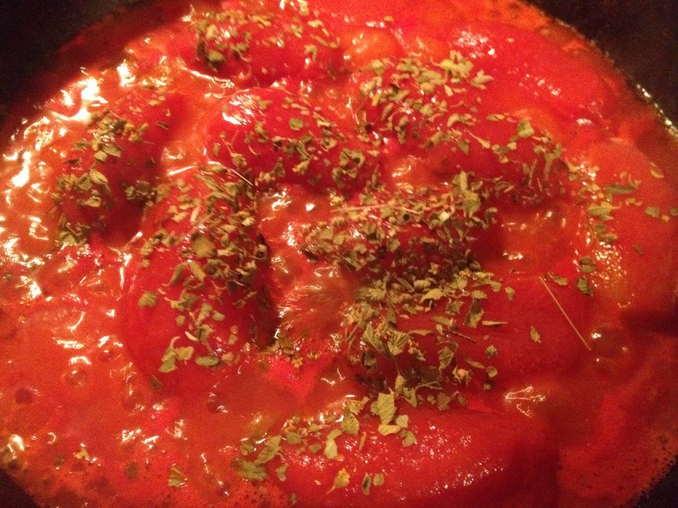 Add the can of tomatoes and salt (maybe some black pepper), cook it for 6-8 minutes on medium heat, add the oregano and cook for another 2 minutes