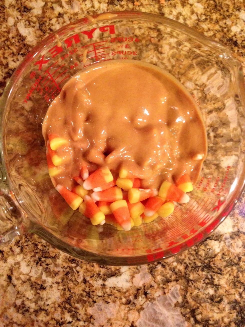 Add the candy corn and the peanut butter to a microwave-safe bowl.