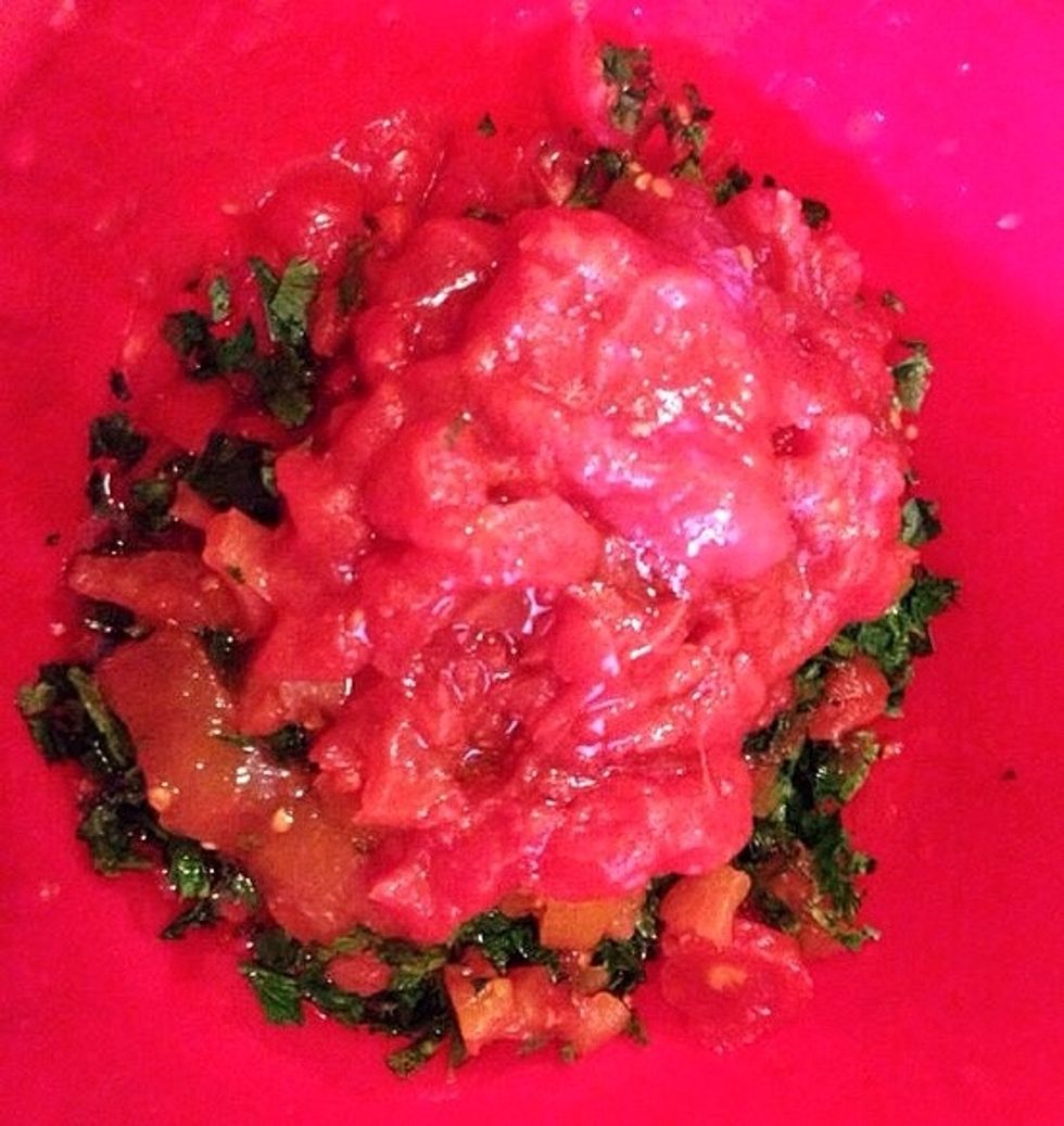 Add the canned tomatoes (roughly chopped).