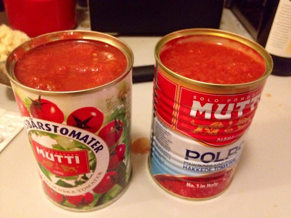 Add the canned tomatoes, we used both chopped (canned) tomatoes and plum tomatoes (about 50/50 of each).