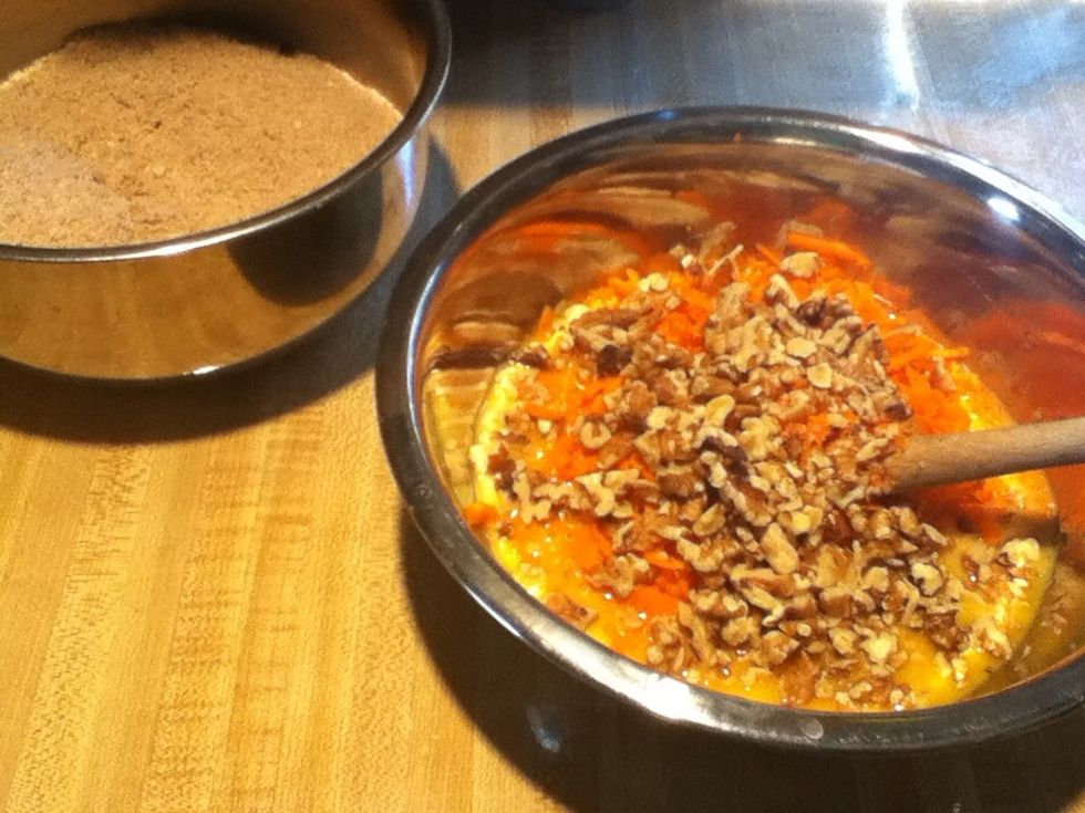Add the carrots and walnuts to the egg mixture.