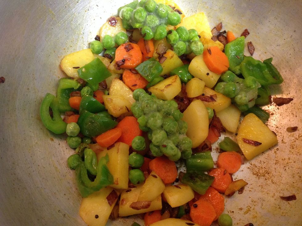Add the carrots, bell pepper to the mix. You can also add other vegetables or substitute any of these with what you love, like celery, broccoli.