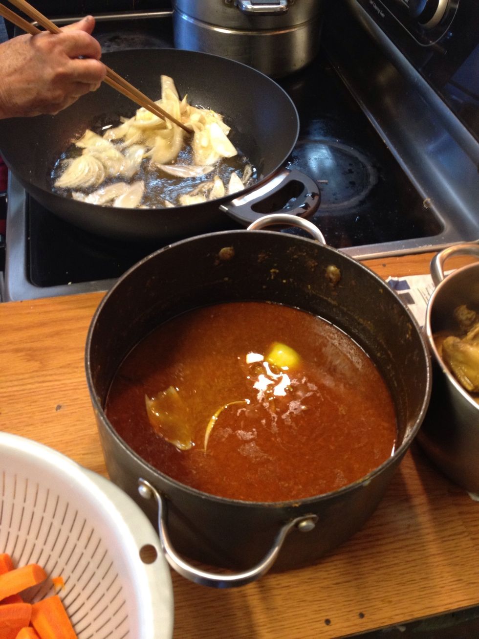 Add the carrots, deep fried onions and potatoes to the curry and bring to a boil.