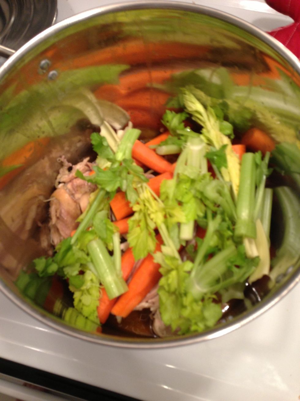 Add the celery tips for more flavor.