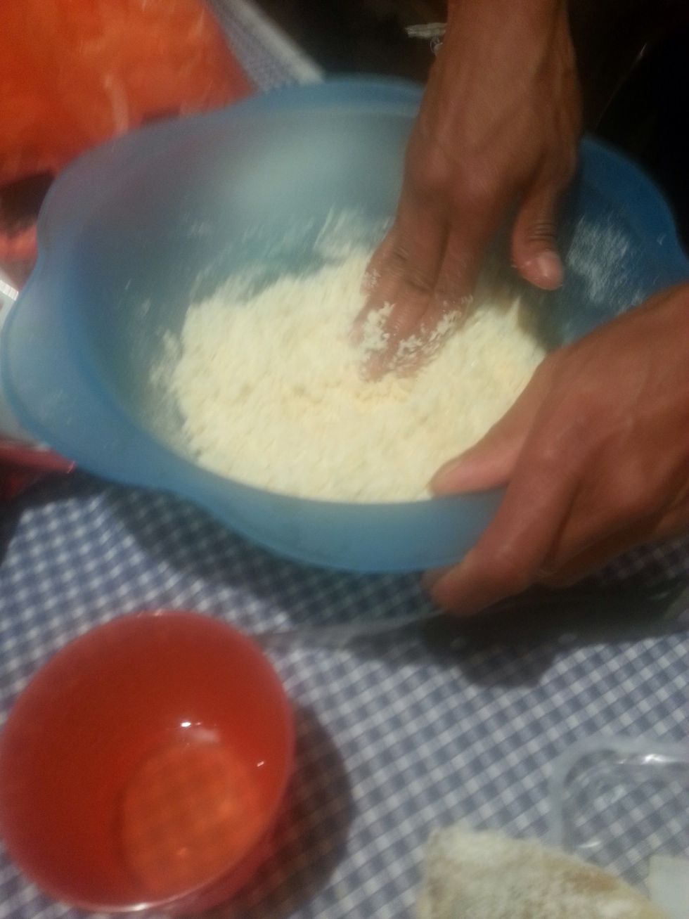 Add the cheese and mix with hands