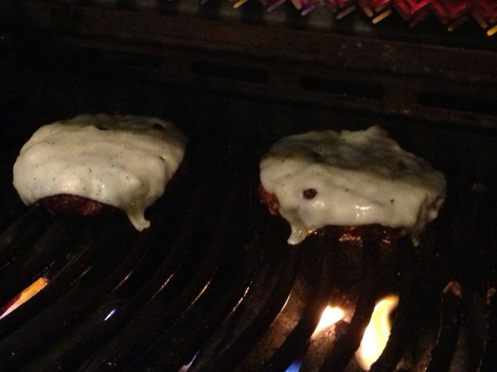 Add the cheese for 30 seconds, before placing onto the bun. You can roast the buns on the top grill, but don't overdo it.