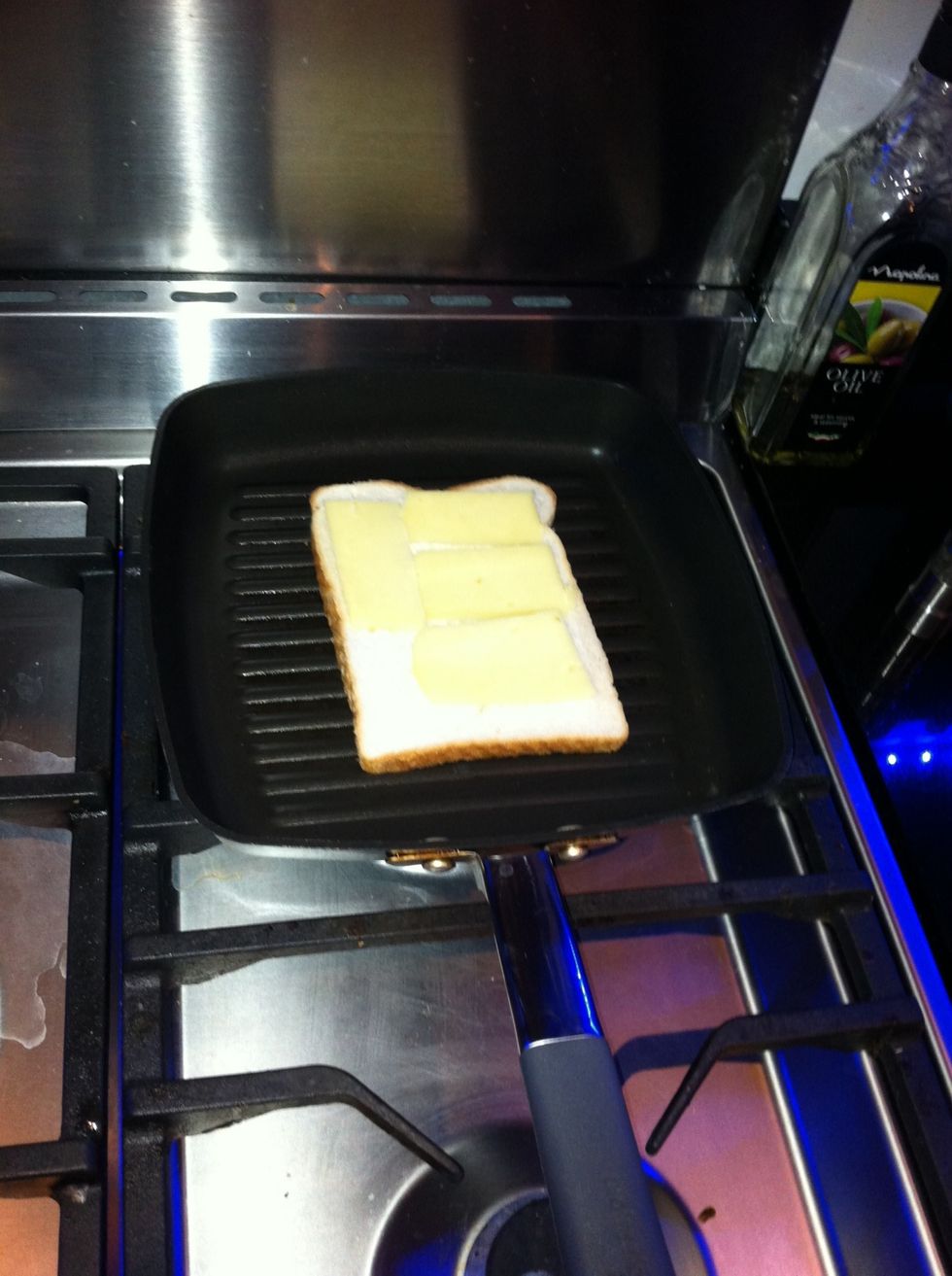 Add the cheese to the bread.