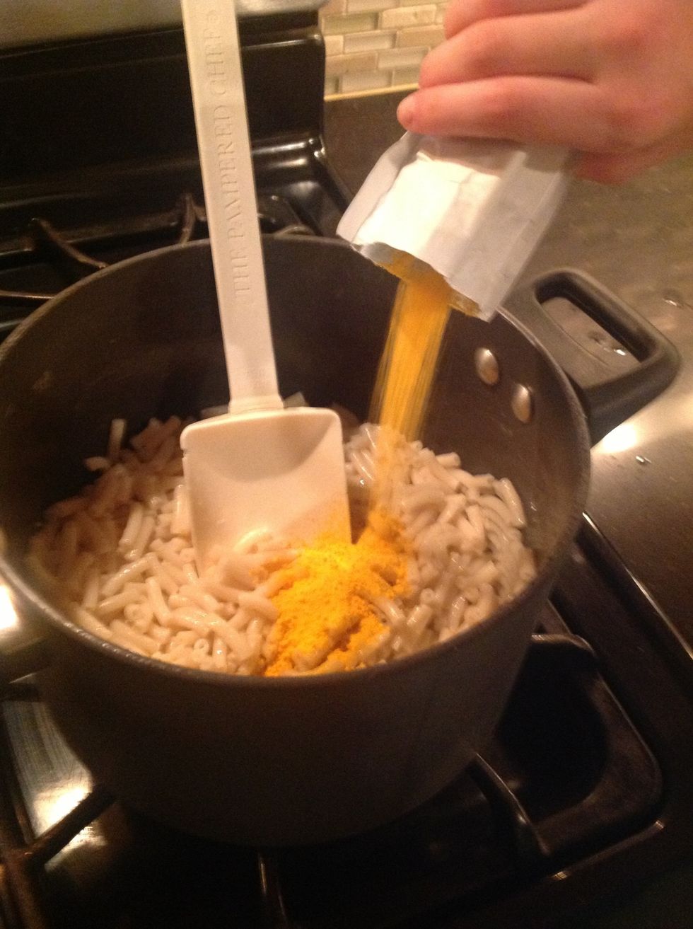 Add the cheese which should be in the box.