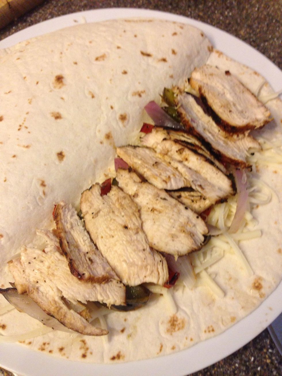 Add the chicken and head back to the grill for the finishing touch.