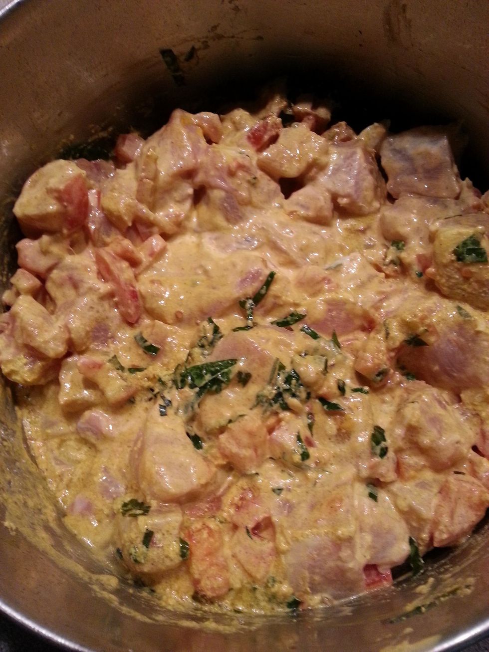 Add the chicken and its marinade to the pot. Bring to a simmer. Cook for 10 minutes. Add the ground cashwnut/ almond to thicken the sauce. Season with salt and add dried chillies if desired.