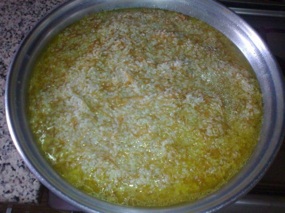 Add the chicken broth and bring the mixture to a boil,turn the heat down so it's simmering