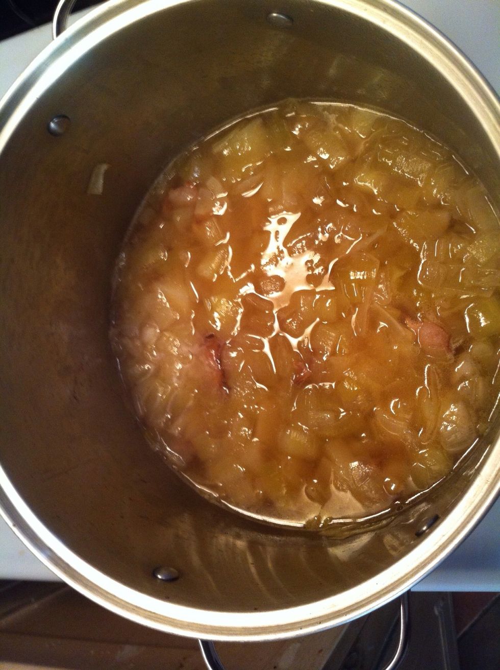 Add the chicken broth, slices potatoes, salt and pepper. Bring to boil. Cover. Lower heat. Simmer 25 mins for cooked thru potatoes.
