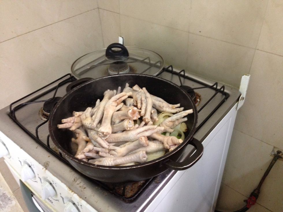 Add the chicken feet. Cook for 5 minutes or until light brown in color.