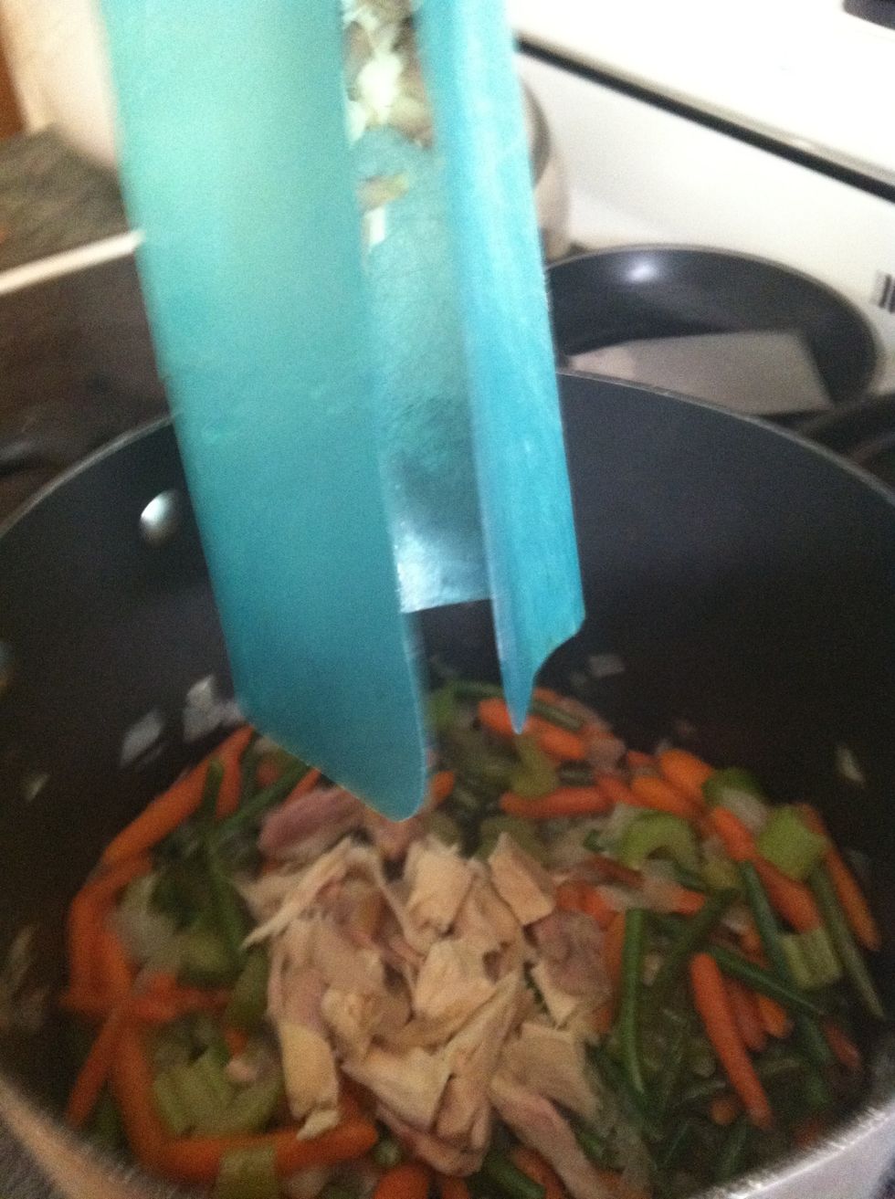 Add the chicken into the soup pot w/ the veg. It smells sooo good in here right now!! Can't wait!