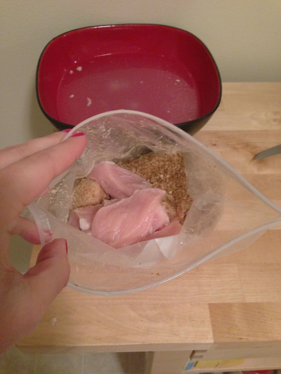 Add the chicken to the ziplock bag, close, and shake the chicken up. This prevents a mess in your kitchen.
