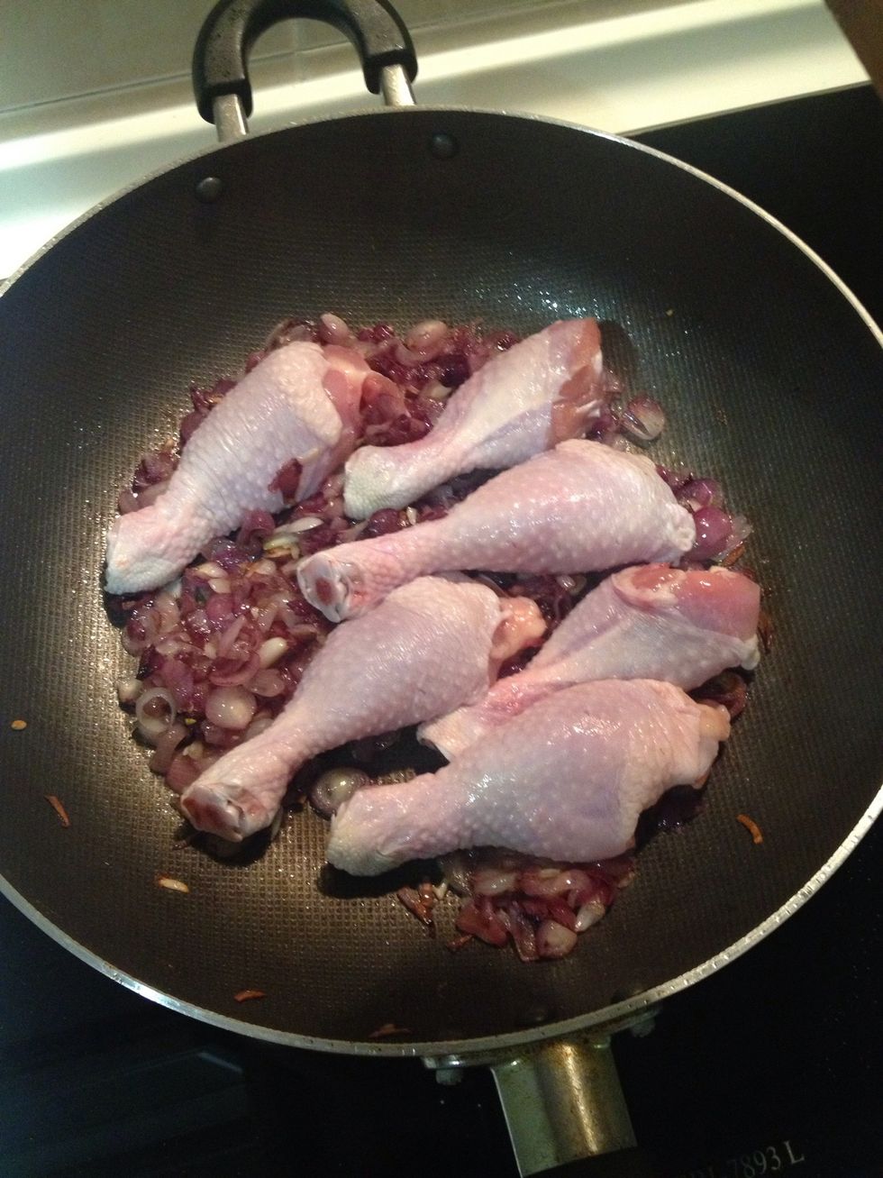 Add the chickens and fry together with the shallots.
