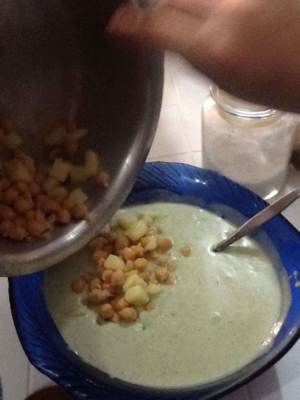 Add the chickpeas and potatoes to the yoghurt mixture along with a tea spoon of chaat masala