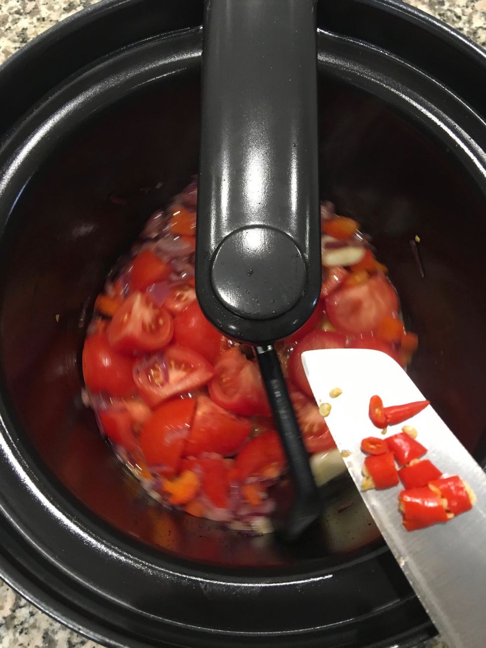 Add the chili and the tomatoes. Cook for 30 mind