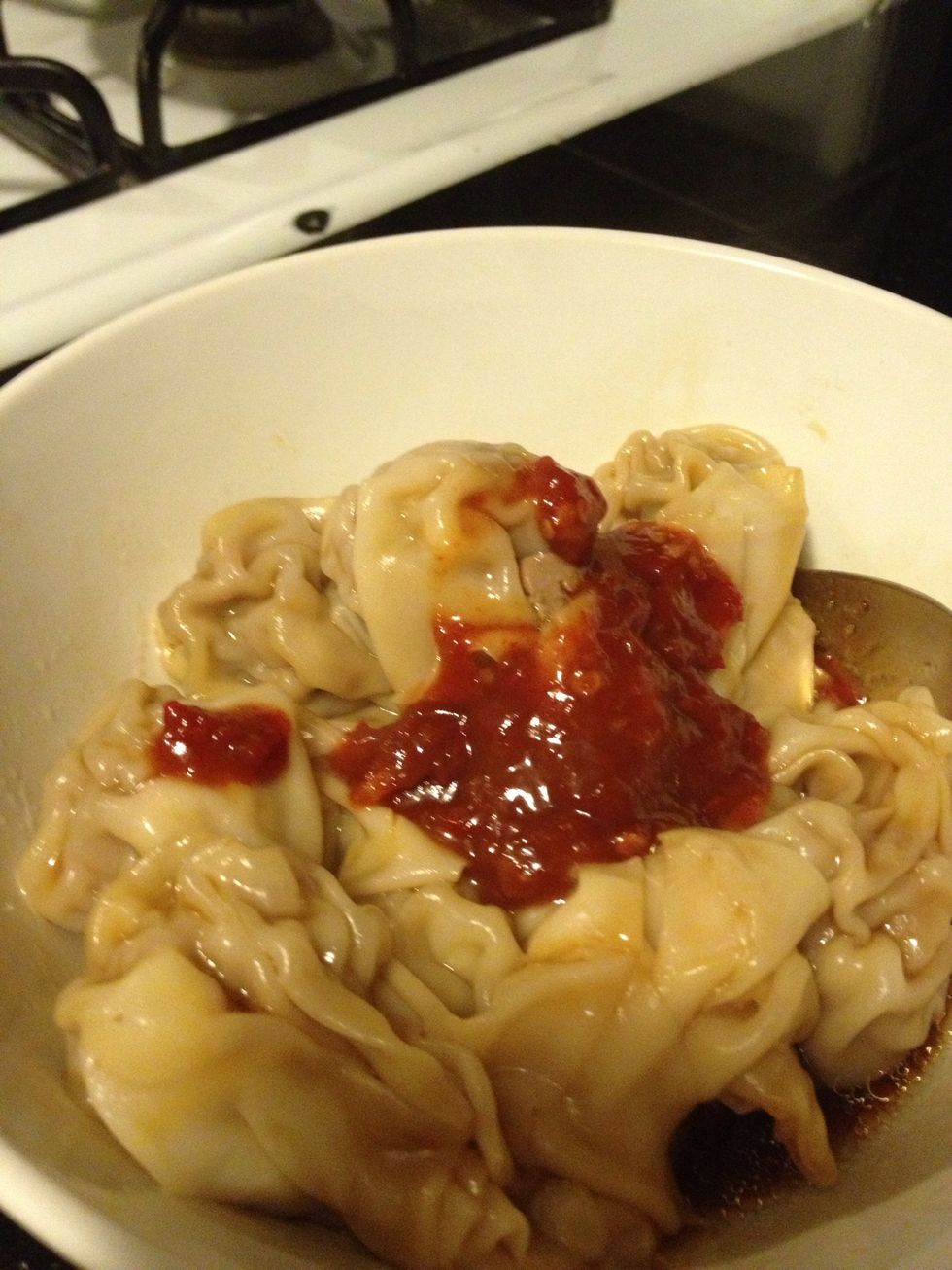 Add the chili bean sauce, don't add too much. 1/2 tsp is good enough. Add 1 tsp soy sauce and 1 black vinegar and mix well.