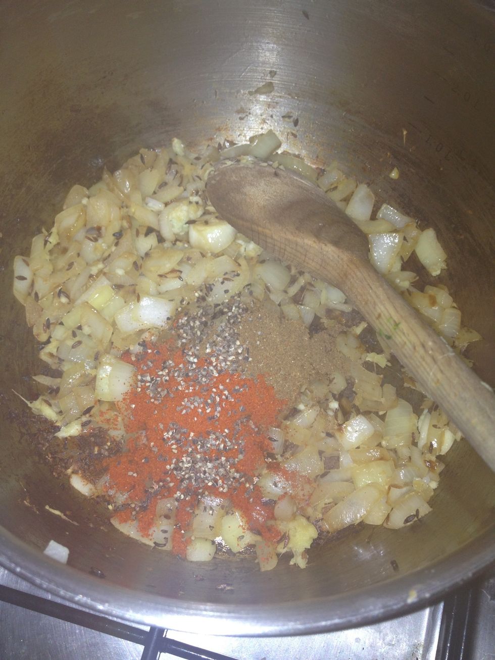 Add the chilli powder, salt, garam masala and pepper and stir.