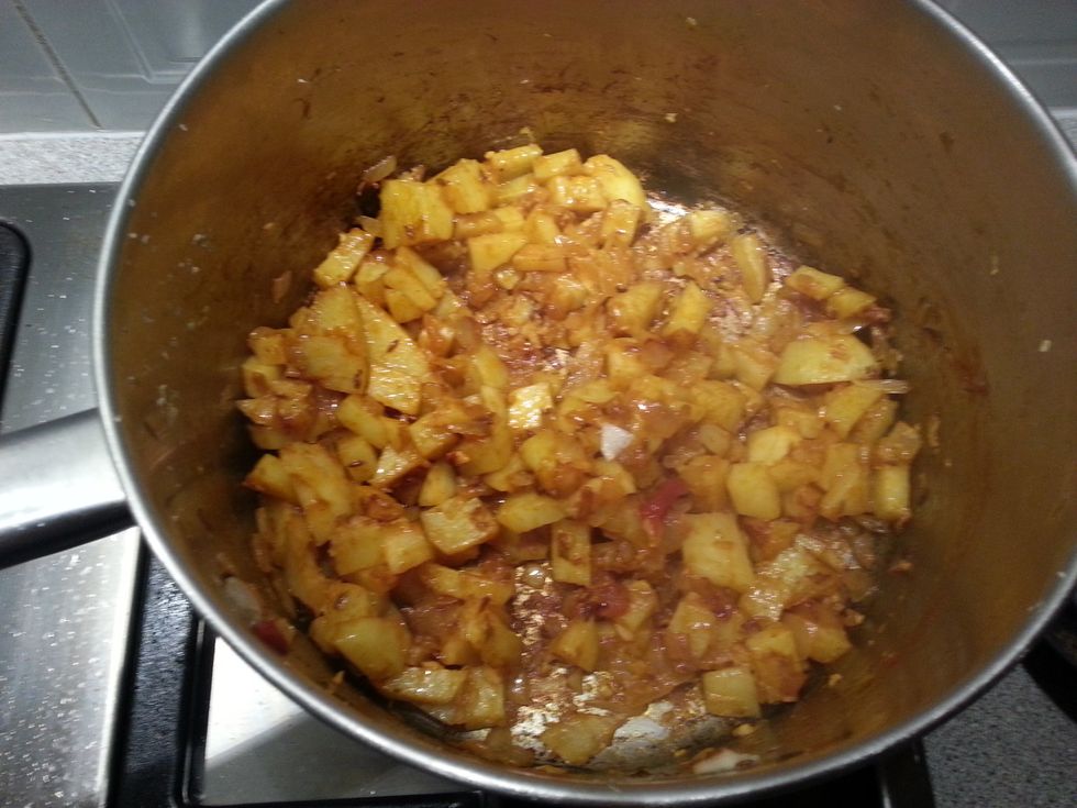Add the chilli powder, turmeric powder and garam masala. Cook for a minute. Add 1-2 tbsn water if the potato mixture is very dry.