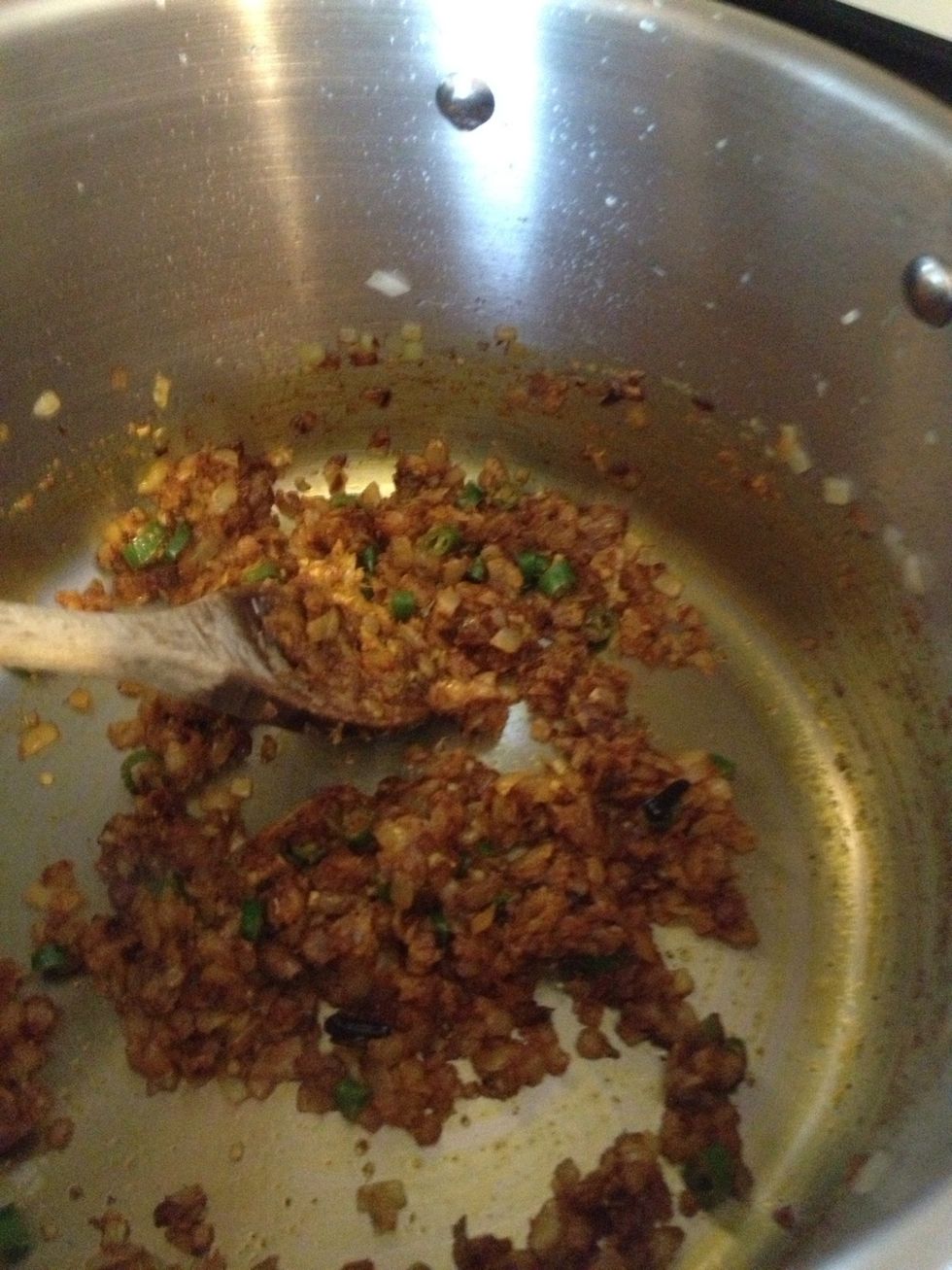 Add the chillies, ginger and garlic and stir and cook in for 30 seconds. Add the chilli powder, cumin, ground coriander, turmeric and salt and mix in for another 30 seconds.