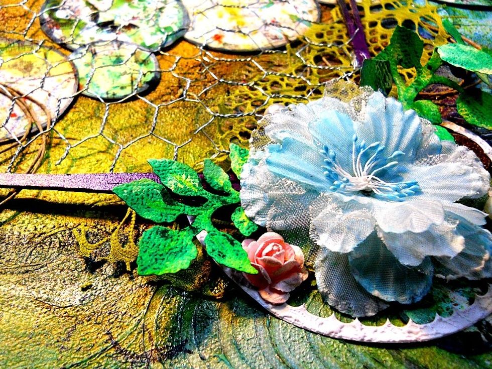 Add the chipboard shapes and the flowers to the canvas as shown. please visit my blog and leave me some love, Kristie Taylor http://kristietaylor.blogspot.com/