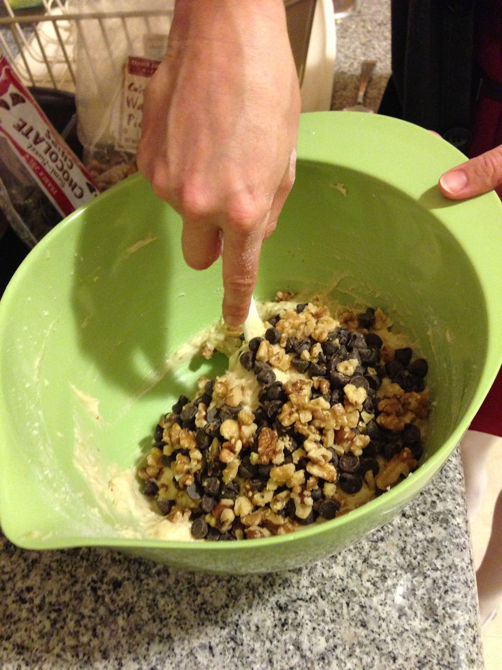 Add the chocolate chips and walnuts and mix. The 1/2 C of chocolate chips is just a guideline - you be the judge of how much chocolatey goodness you'd like in your banana bread.