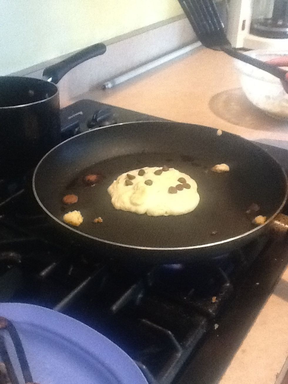 Add the chocolate chips to the panckae (how many you want)