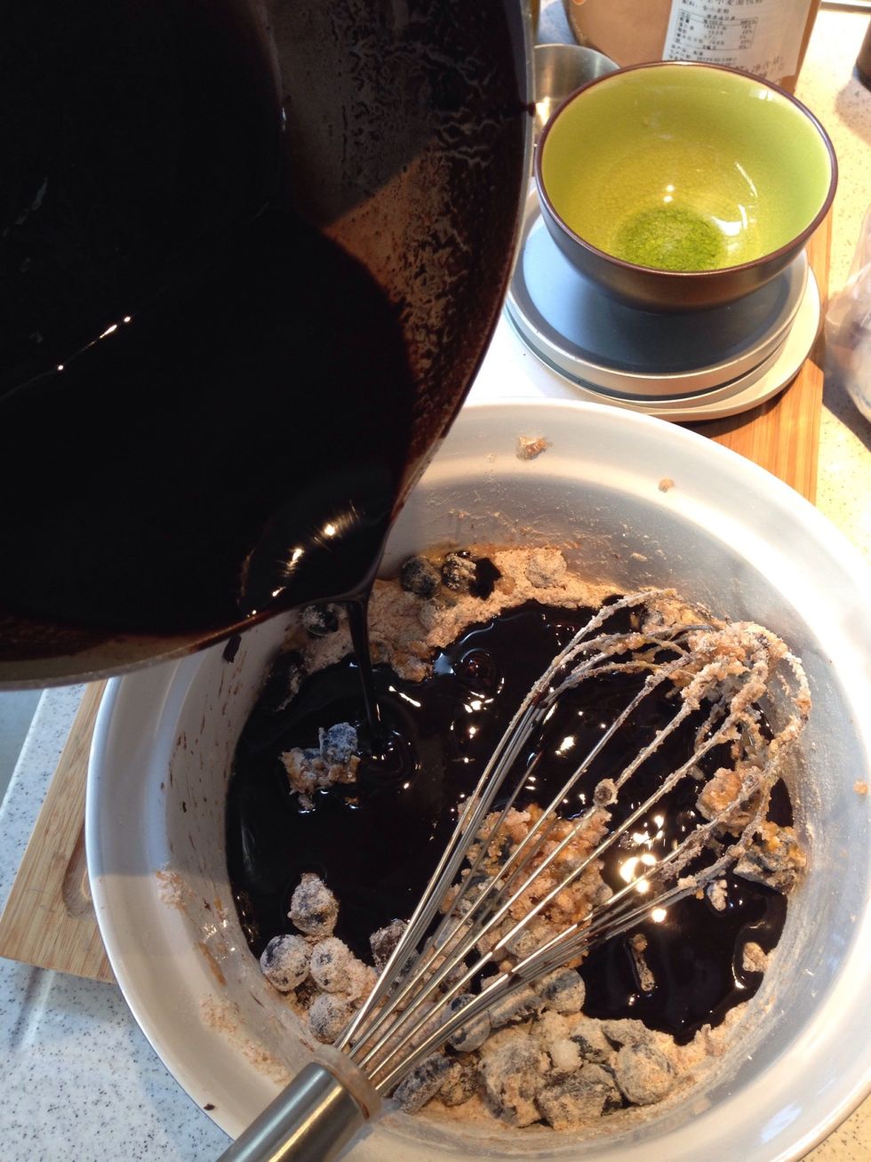 Add the chocolate mixture into the dry ingredients and mix well. I would suggest to use a hand whisk instead of an electric mixer. Twist the whisk & turn the bowl until batter is well combined.